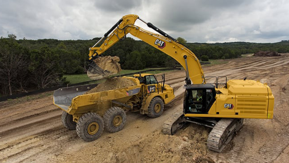 CAT ® Hydraulic Excavators and Articulated Dump Trucks in action